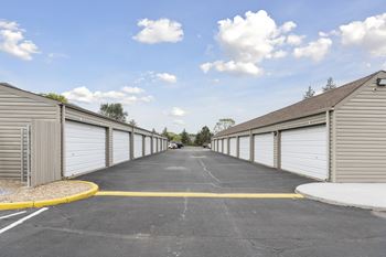 A long row of garage doors are closed.